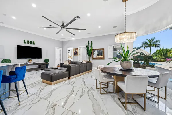 a bedroom with a bed and ceiling fan