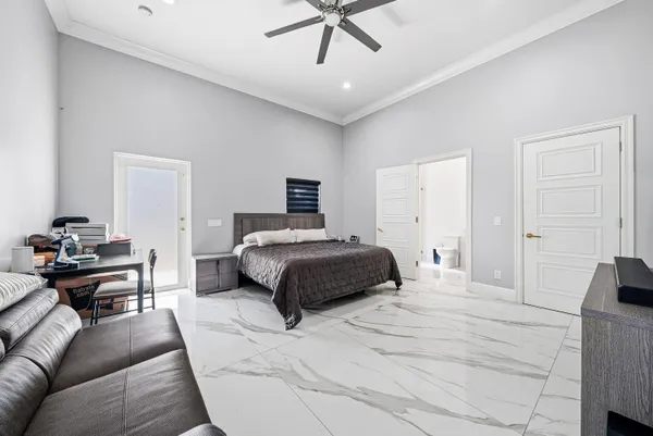 a bathroom with a double vanity sink toilet and shower