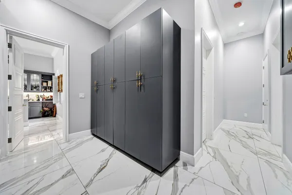 a view of a patio with a table and chairs under an umbrella