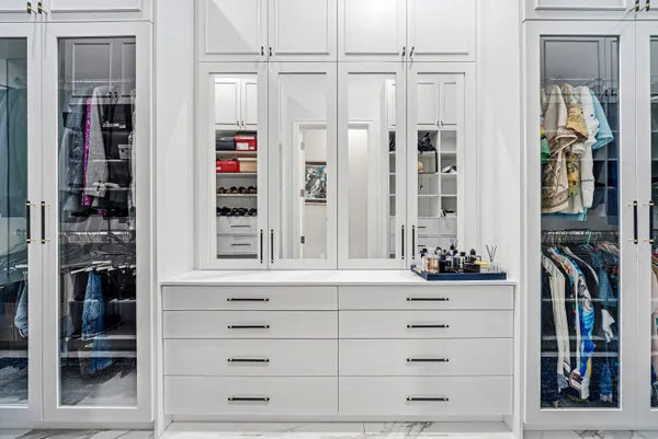 a lobby with furniture and potted plants