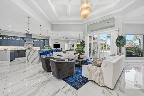 a large kitchen with stainless steel appliances granite countertop a stove and cabinets