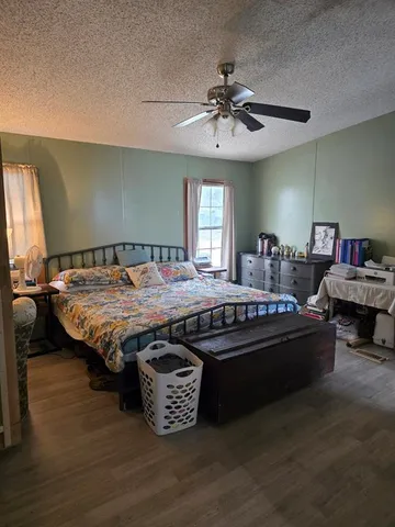 a bed room with furniture and a window