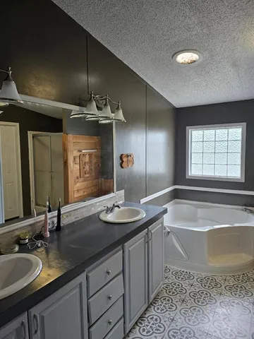 a bathroom with a tub and shower