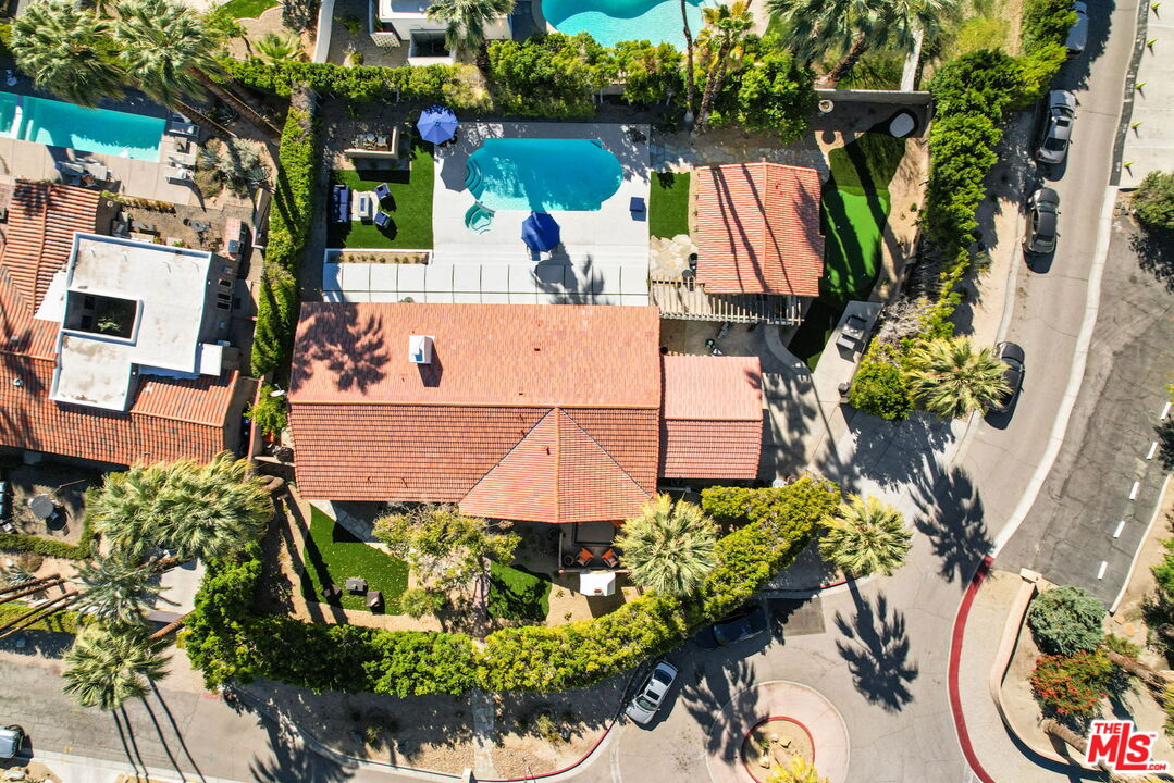 327 East Vía Altamira Palm Springs, CA 92262 - Photo 1 of 53 an aerial view of a house with a yard and garden