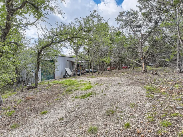 a backyard of a house with lots of green space