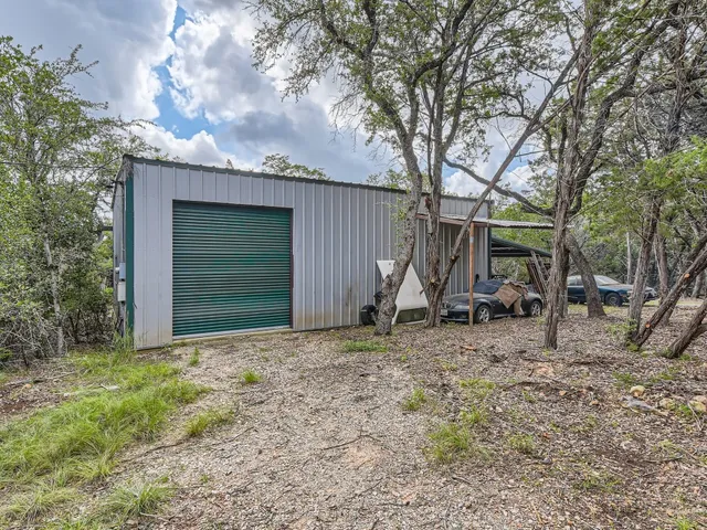 a view of a house with backyard