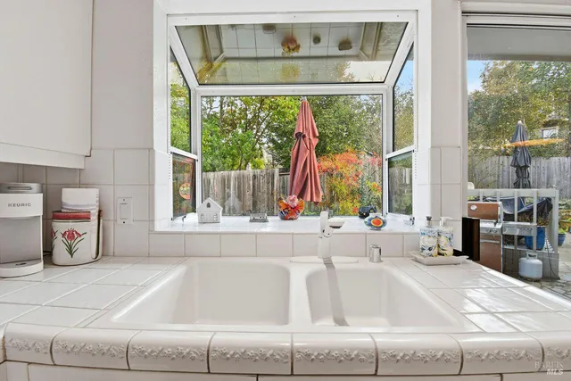 a living room with a large window and table