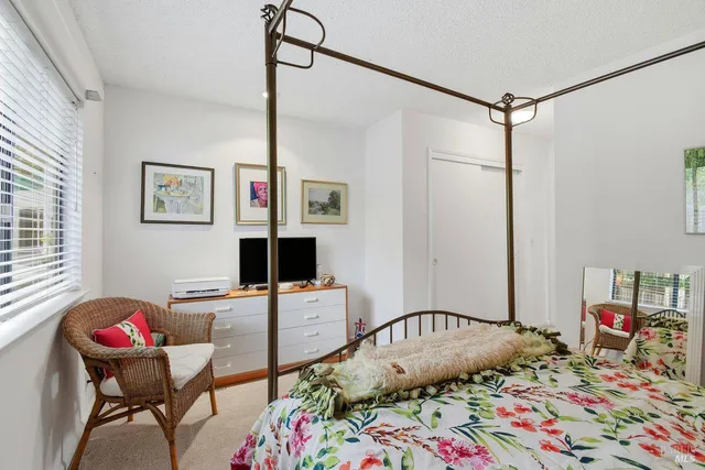 a bedroom with bed and furniture