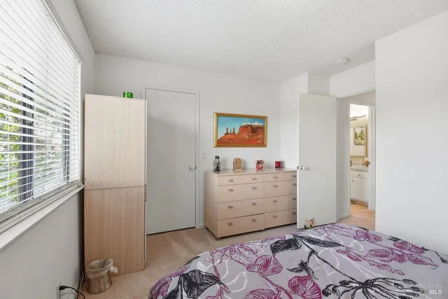 a room with a dresser and a window