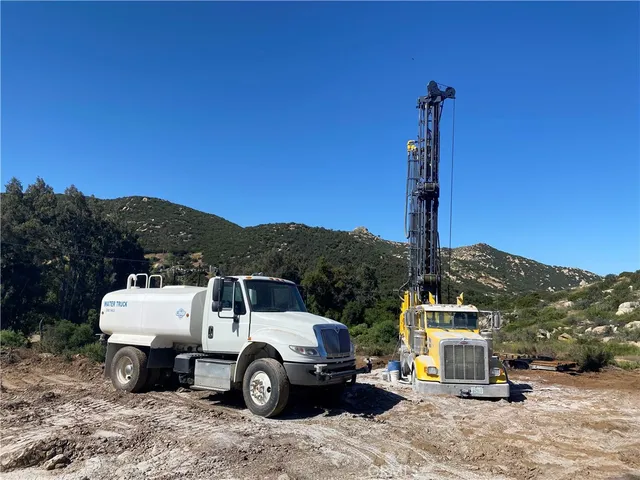 a view of swimming pool with sitting area