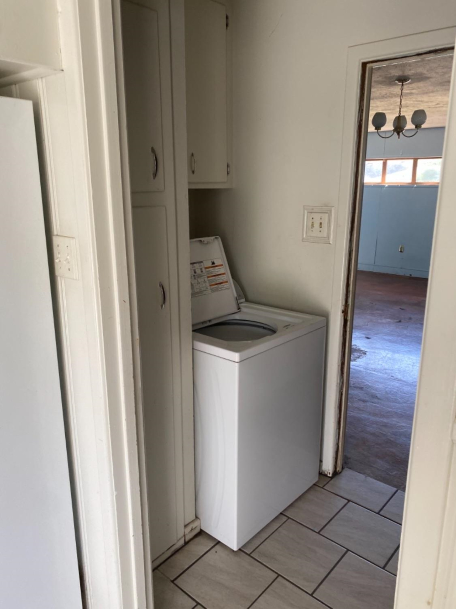 4604 28th Street Lubbock, TX 79410 - Photo 12 of 19 a utility room with a window dryer and washer