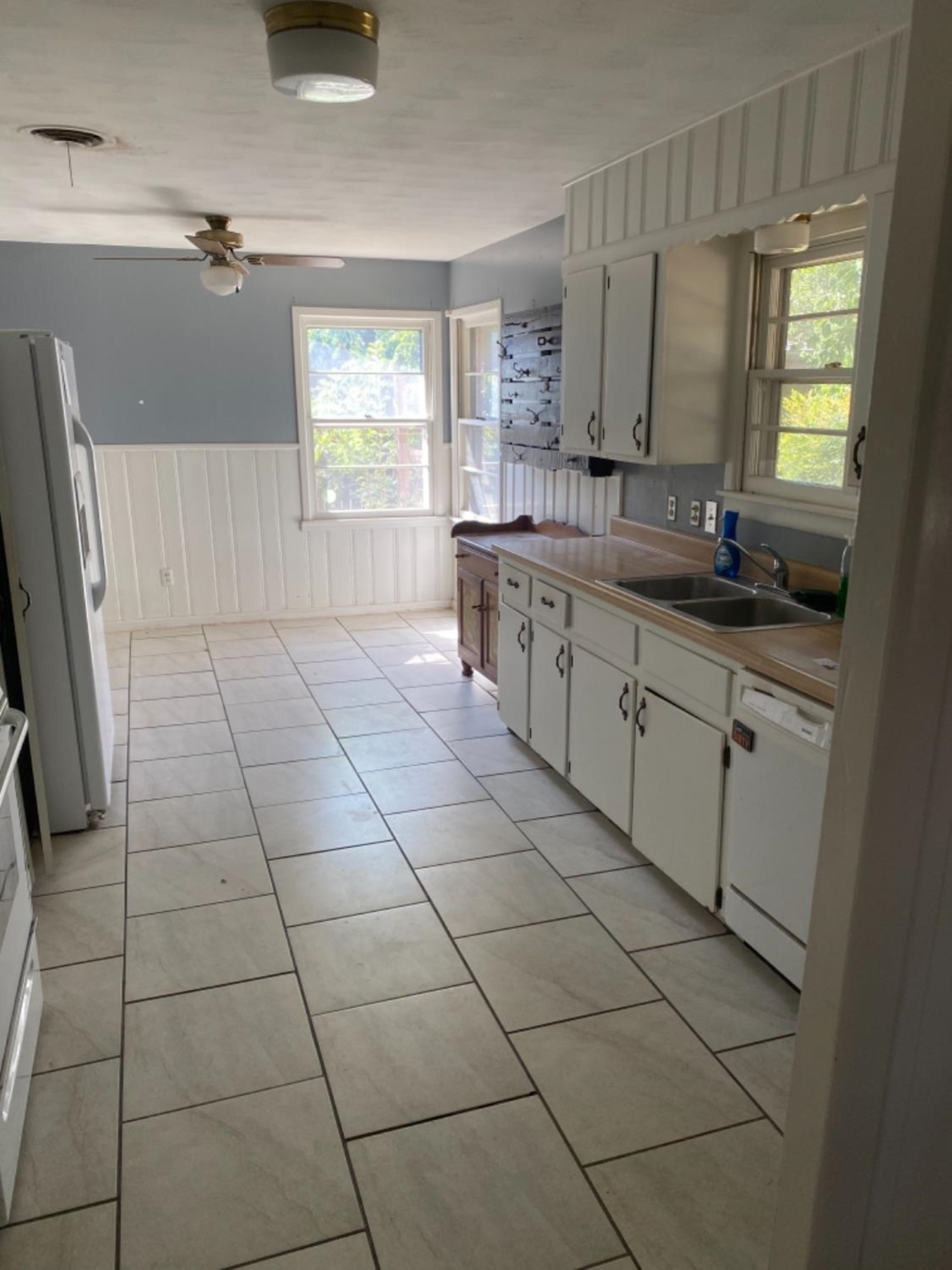 4604 28th Street Lubbock, TX 79410 - Photo 14 of 19 a large bathroom with a granite countertop sink a mirror and a bathtub