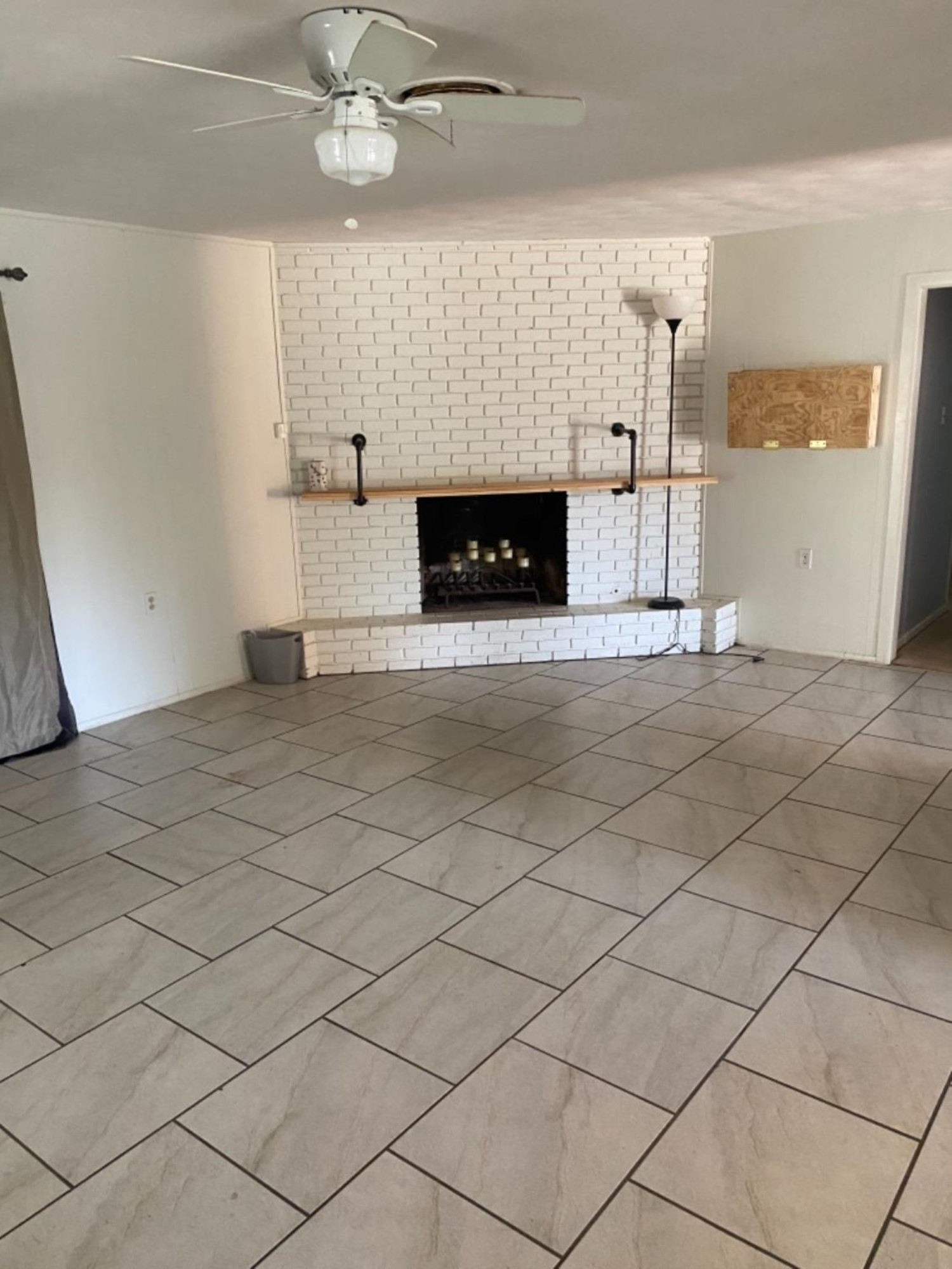 4604 28th Street Lubbock, TX 79410 - Photo 17 of 19 a view of empty room with kitchen and fireplace