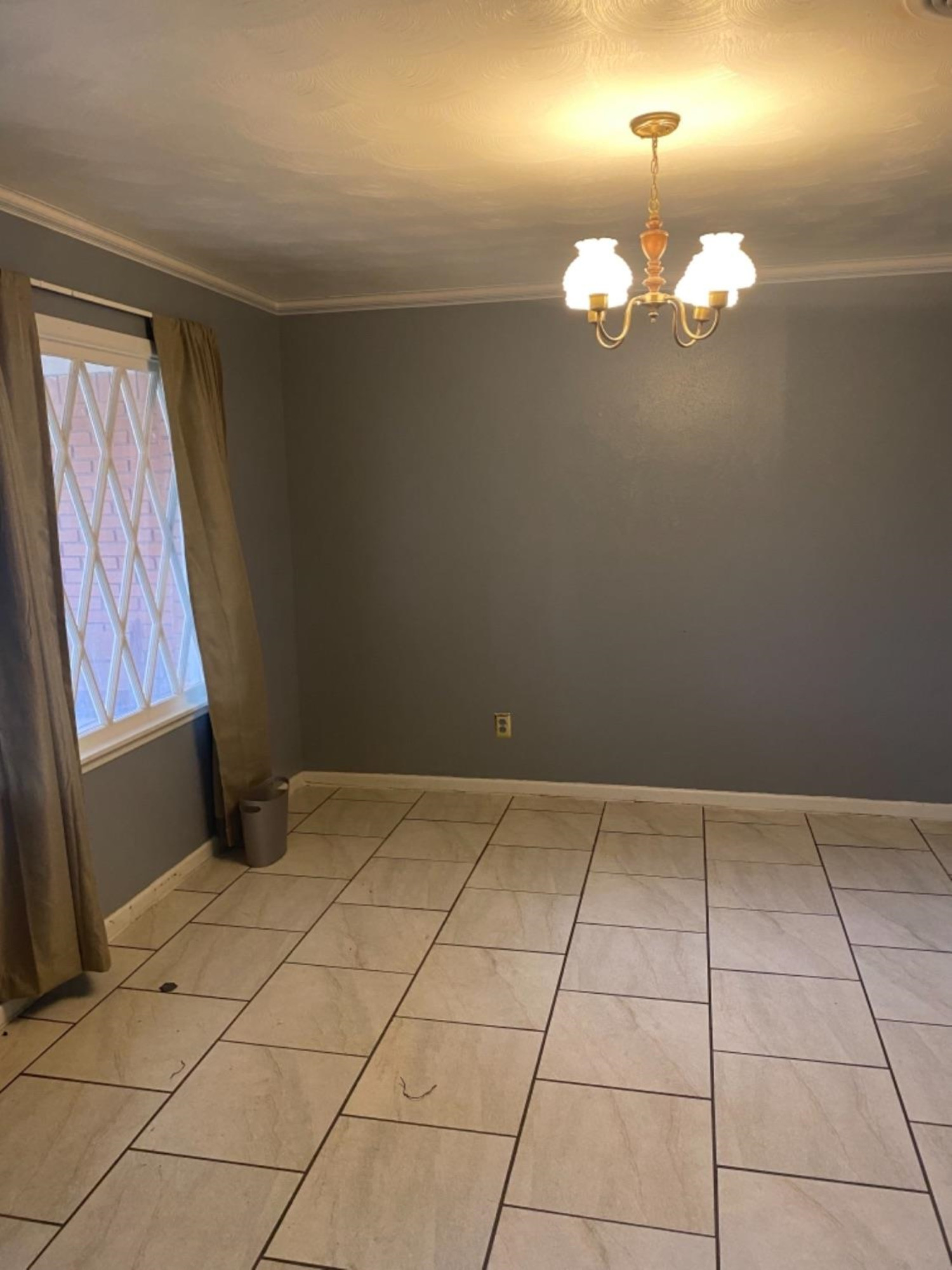 4604 28th Street Lubbock, TX 79410 - Photo 3 of 19 a view of an empty room with a chandelier fan
