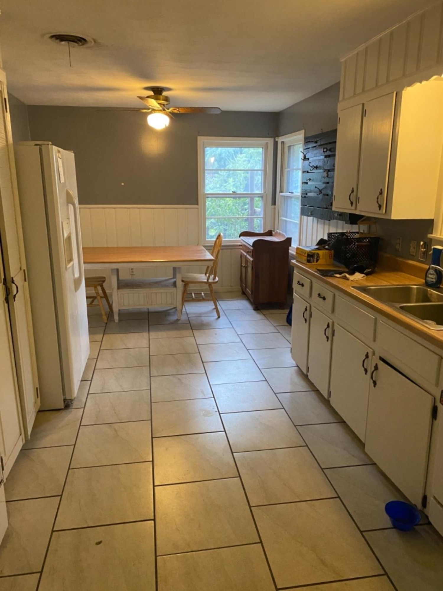 4604 28th Street Lubbock, TX 79410 - Photo 4 of 19 a kitchen with a sink a stove cabinets and counter space