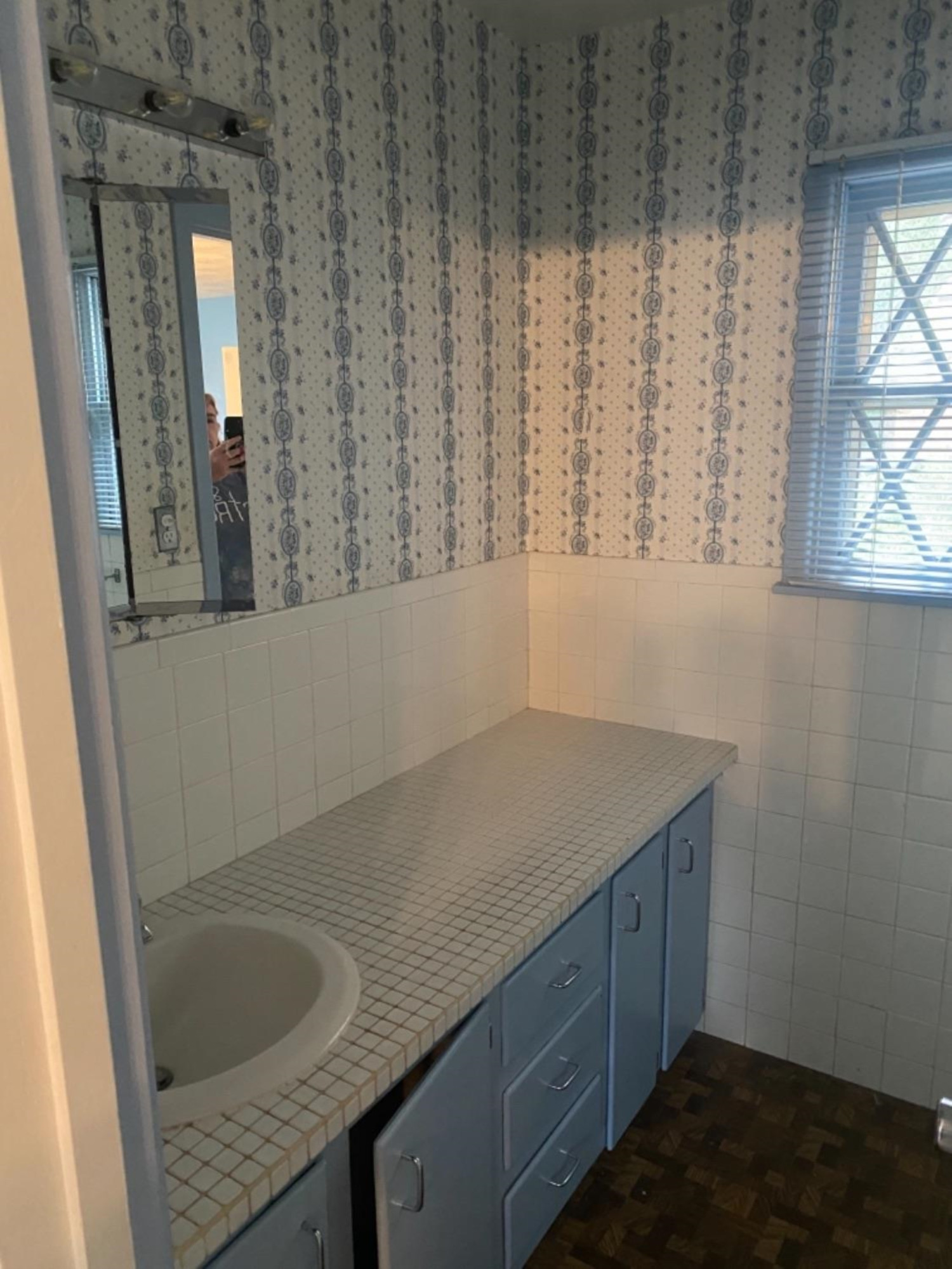 4604 28th Street Lubbock, TX 79410 - Photo 7 of 19 a room with a sink cabinets and a window