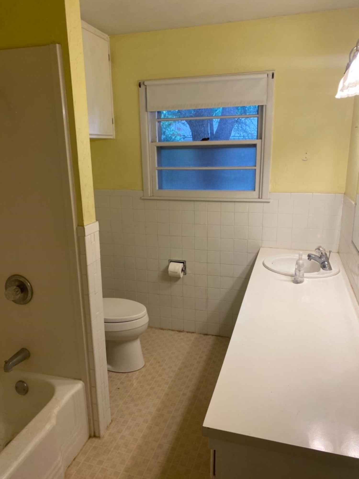 4604 28th Street Lubbock, TX 79410 - Photo 8 of 19 a bathroom with a sink and a mirror