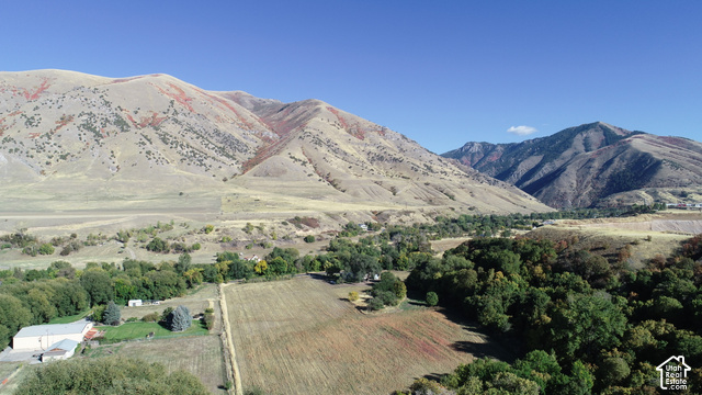 5035 South Hollow Road Logan, UT 84321 - Photo 1 of 19 Expansive mountainous views with a hill buffer with varied vegetation, including mature trees and cultivated fields