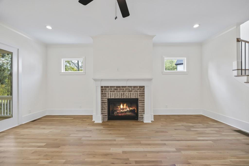 611 Foster Park Lane Madison, GA 30650 - Photo 19 of 54 a living room with furniture and a fireplace
