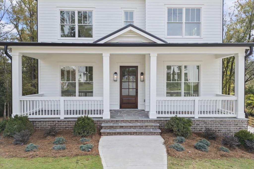 611 Foster Park Lane Madison, GA 30650 - Photo 2 of 54 front view of a house with a porch