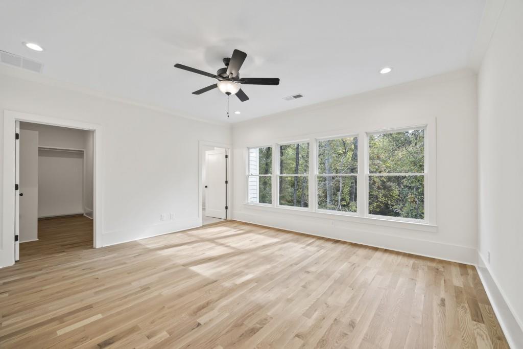 611 Foster Park Lane Madison, GA 30650 - Photo 26 of 54 a view of an empty room with a window and wooden floor