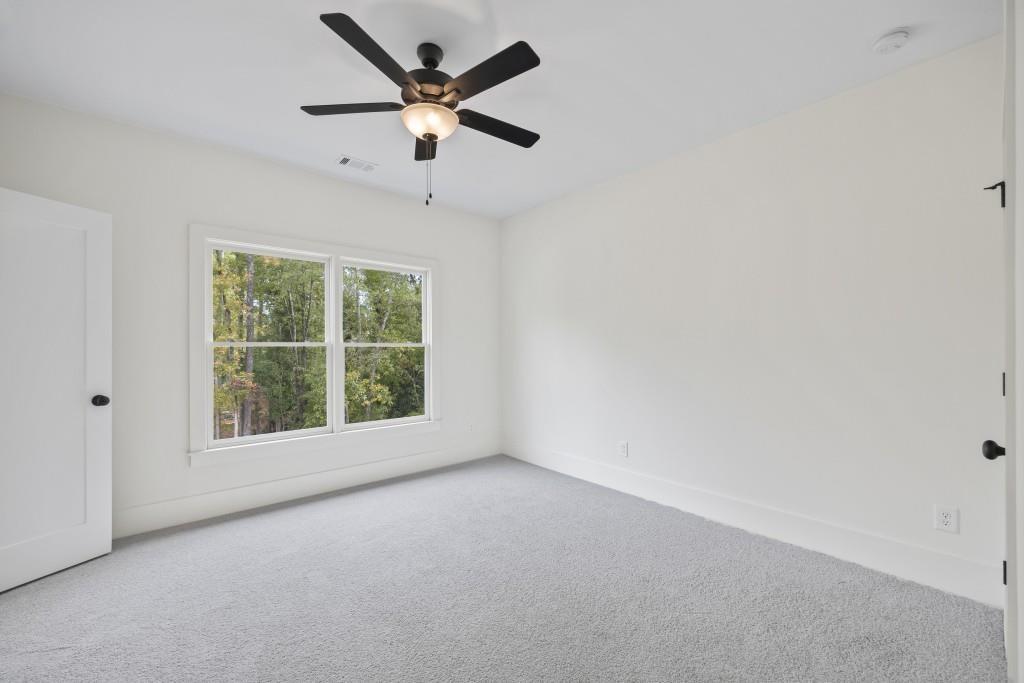611 Foster Park Lane Madison, GA 30650 - Photo 32 of 54 an empty room with a window