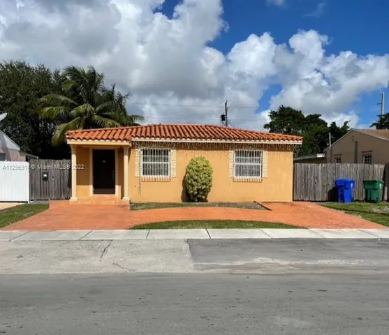 a front view of a house with a garage