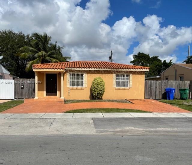 a front view of a house with a garage