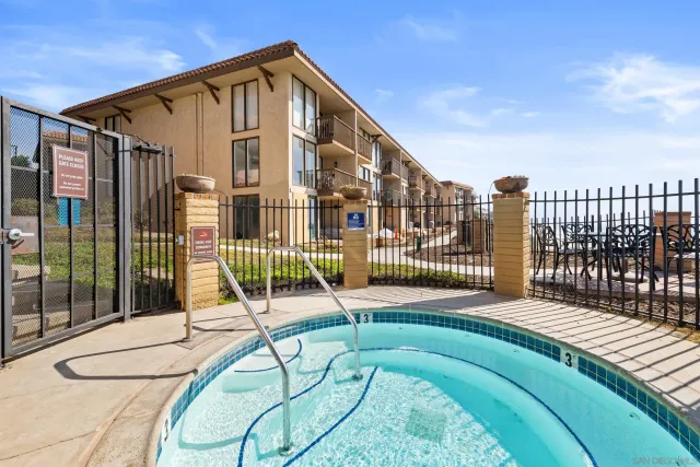 a view of a house with swimming pool and porch