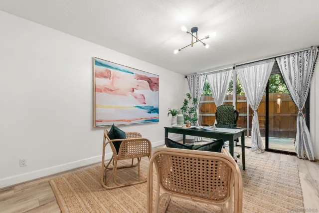 a living room with furniture and a rug