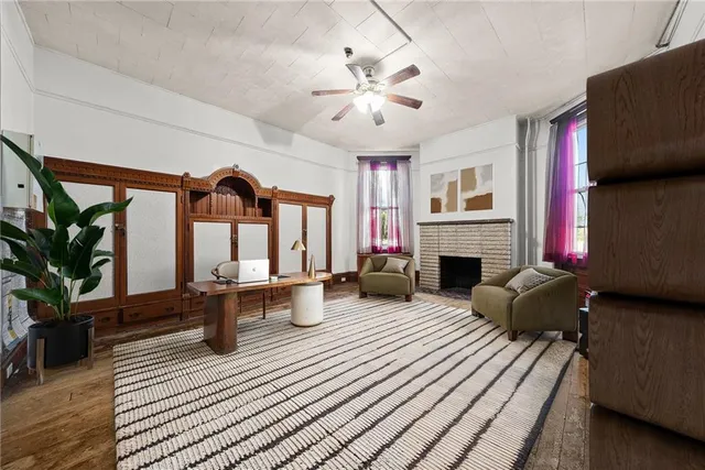 a living room with furniture and a fireplace