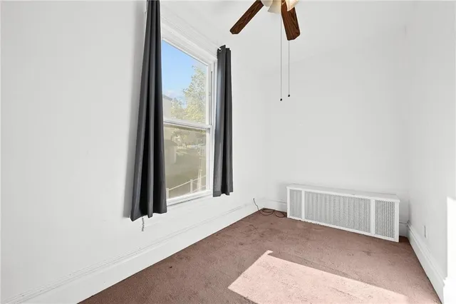 a view of a bathroom with wooden floor