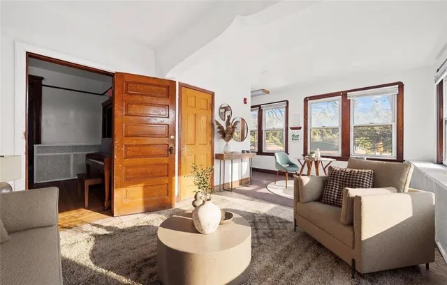 a living room with furniture and a large window