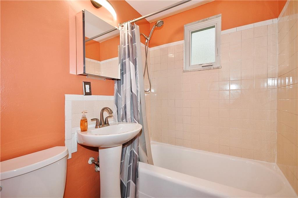 416 Pearce Road Pittsburgh, PA 15234 - Photo 15 of 32 a bathroom with a sink a toilet and shower