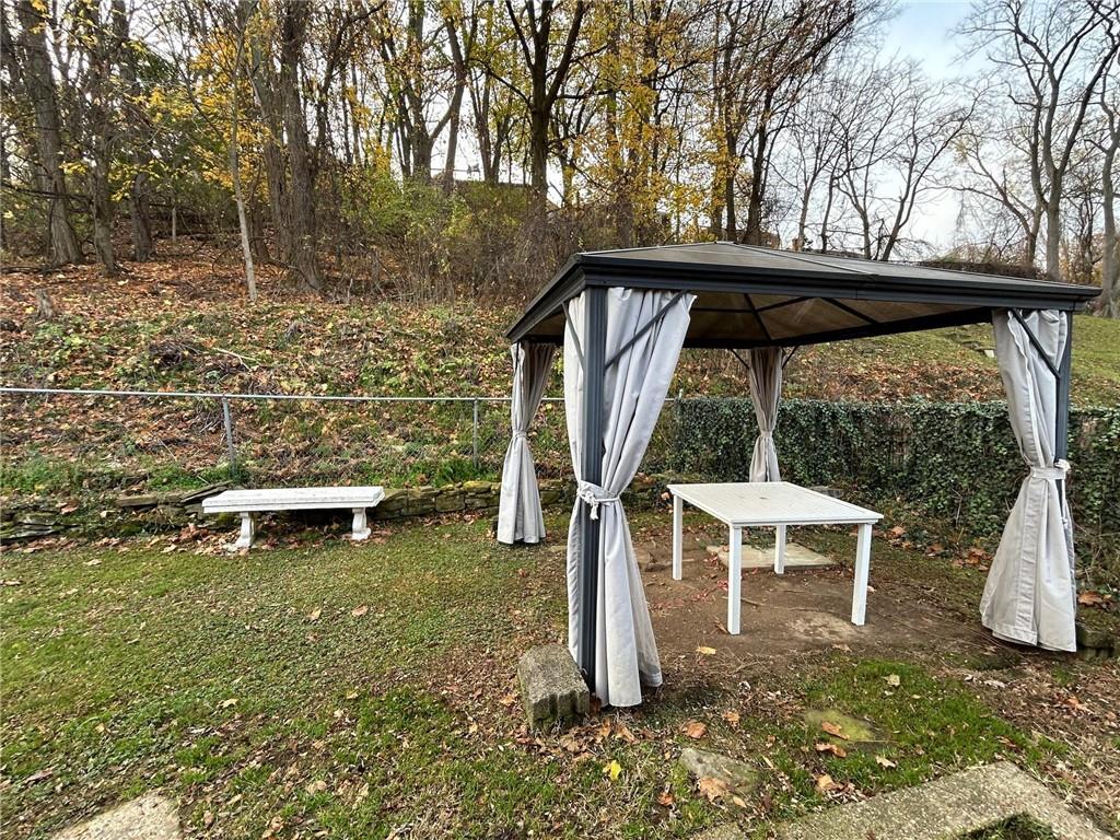 416 Pearce Road Pittsburgh, PA 15234 - Photo 29 of 32 a view of a chair and table in the backyard