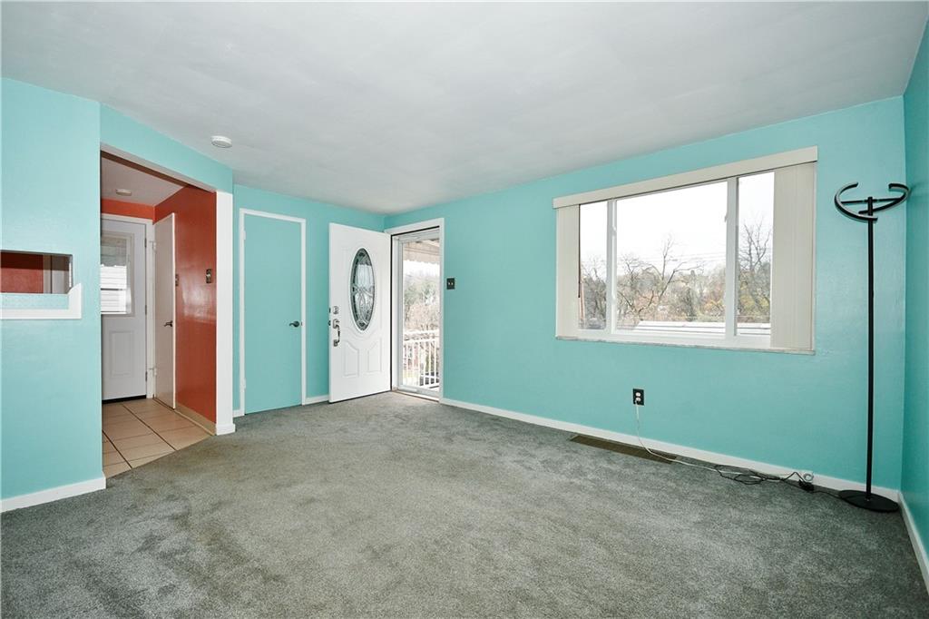 416 Pearce Road Pittsburgh, PA 15234 - Photo 5 of 32 a view of an empty room with a window