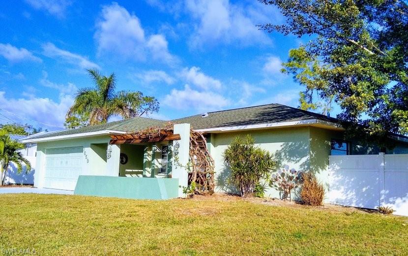 7659 Laurel Valley Road Fort Myers, FL 33967 - Photo 3 of 35 a view of a house with a yard