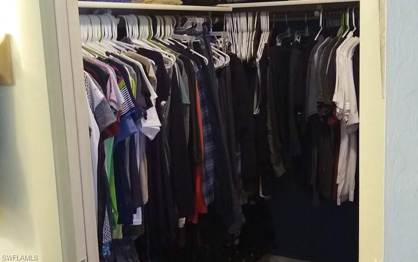 7659 Laurel Valley Road Fort Myers, FL 33967 - Photo 33 of 35 a view of walk in closet with clothes and shoes