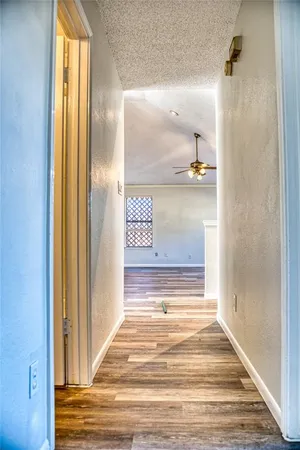 a view of room with window and wooden floor