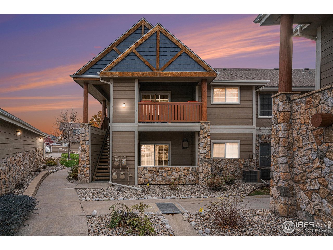 124 Beacon Way, Unit 3 Windsor, CO 80550 - Photo 1 of 22 a front view of a house with a garden