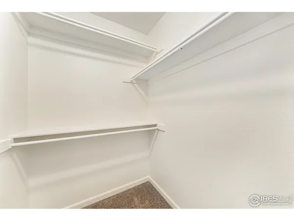 a view of an empty walk in closet