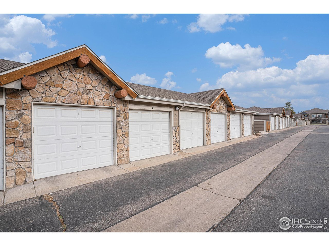 124 Beacon Way, Unit 3 Windsor, CO 80550 - Photo 22 of 22 a view of a house with a garage