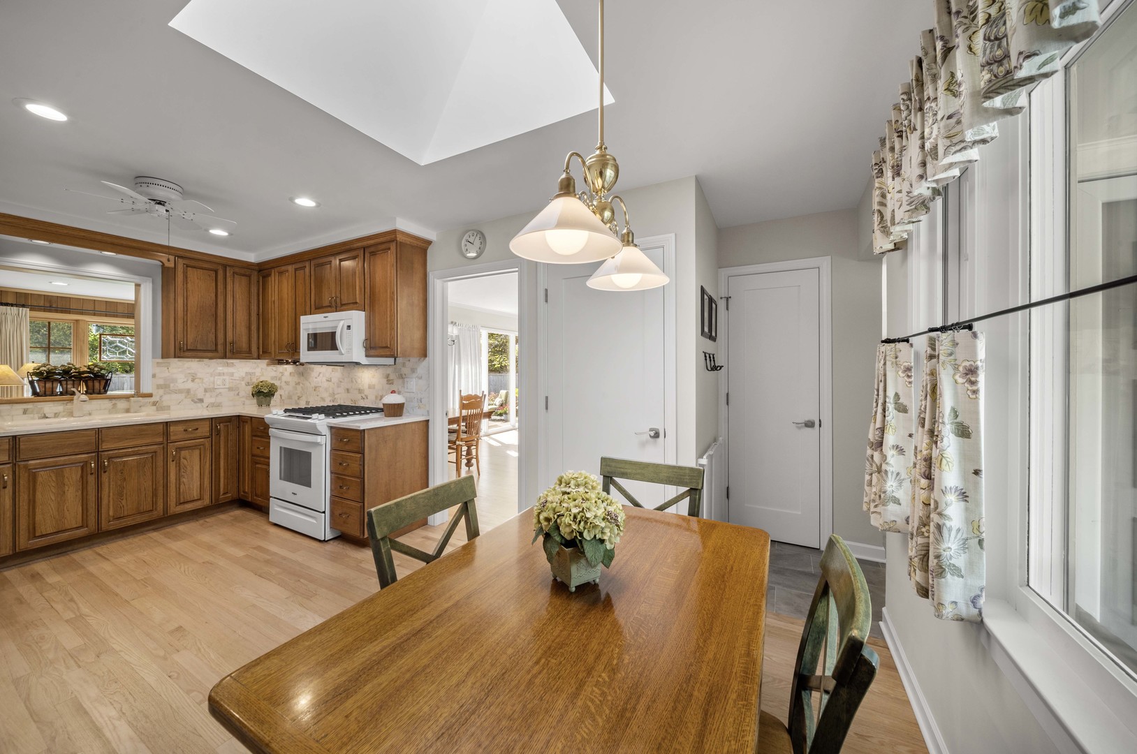 275 Ingram Street Northfield, IL 60093 - Photo 11 of 29 a kitchen with a sink appliances and cabinets