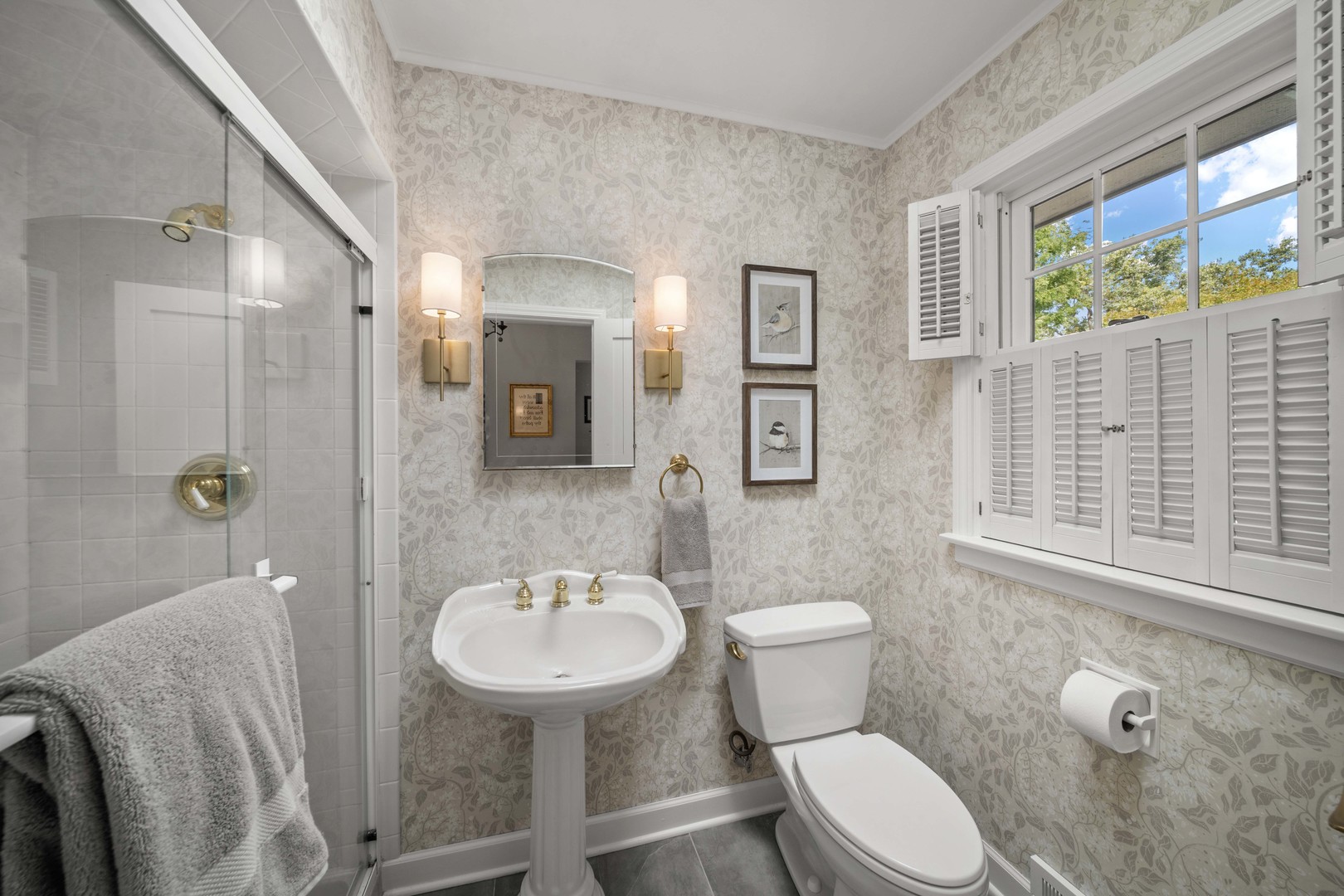 275 Ingram Street Northfield, IL 60093 - Photo 18 of 29 a bathroom with a sink toilet a mirror and shower