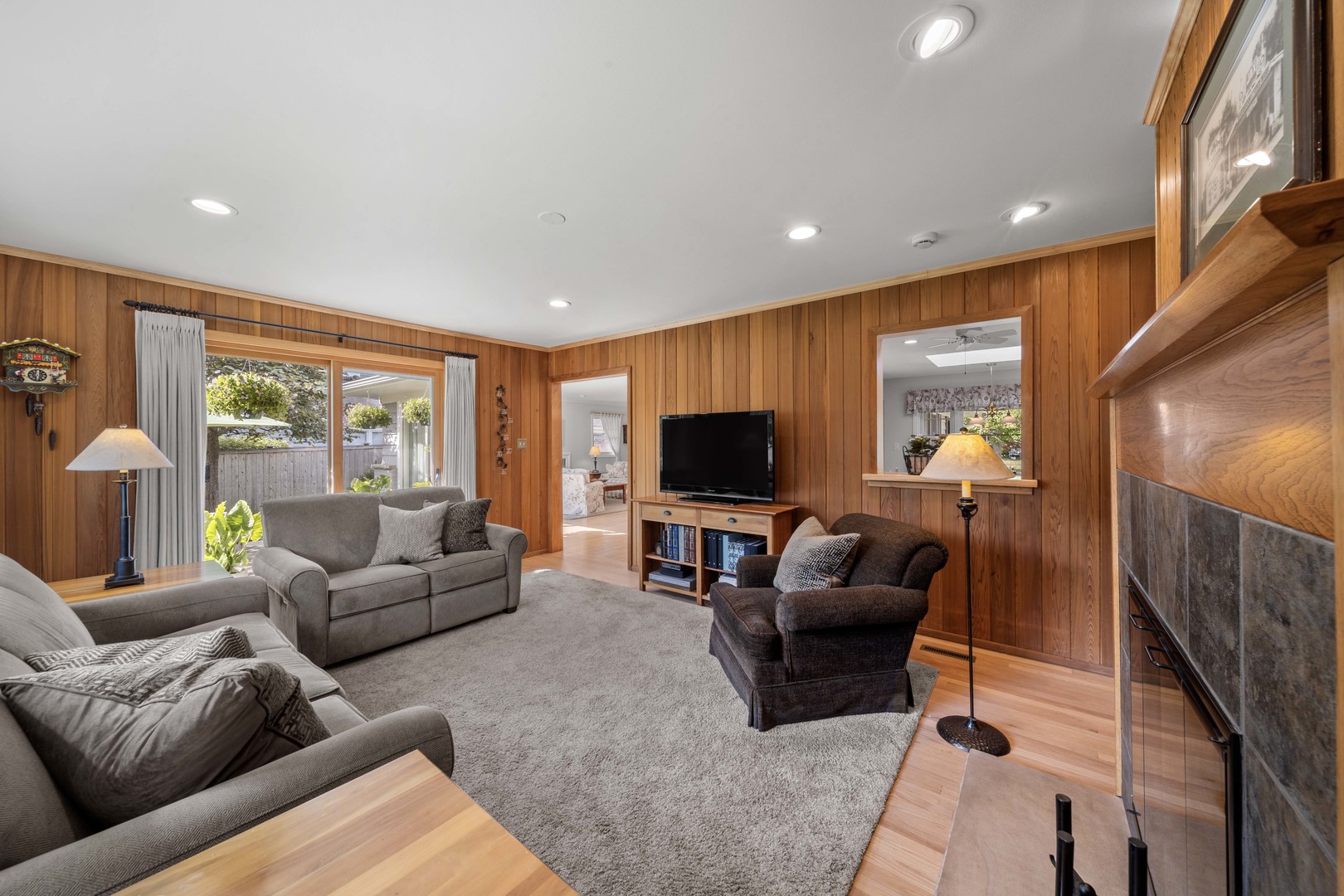 275 Ingram Street Northfield, IL 60093 - Photo 20 of 29 a living room with furniture and a flat screen tv