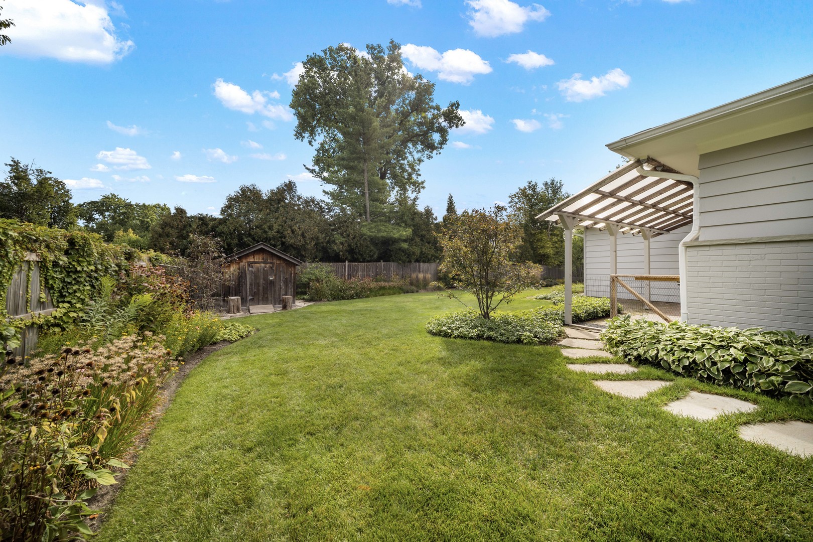 275 Ingram Street Northfield, IL 60093 - Photo 26 of 29 a view of a fountain in front of a house