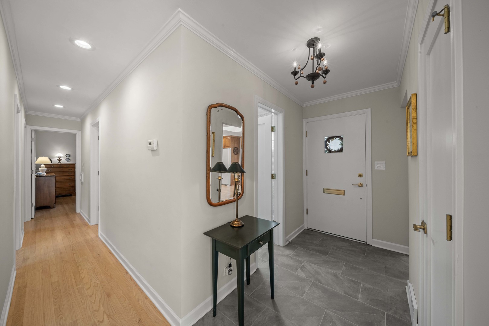 275 Ingram Street Northfield, IL 60093 - Photo 5 of 29 a view of a hallway view with furniture and a chandelier