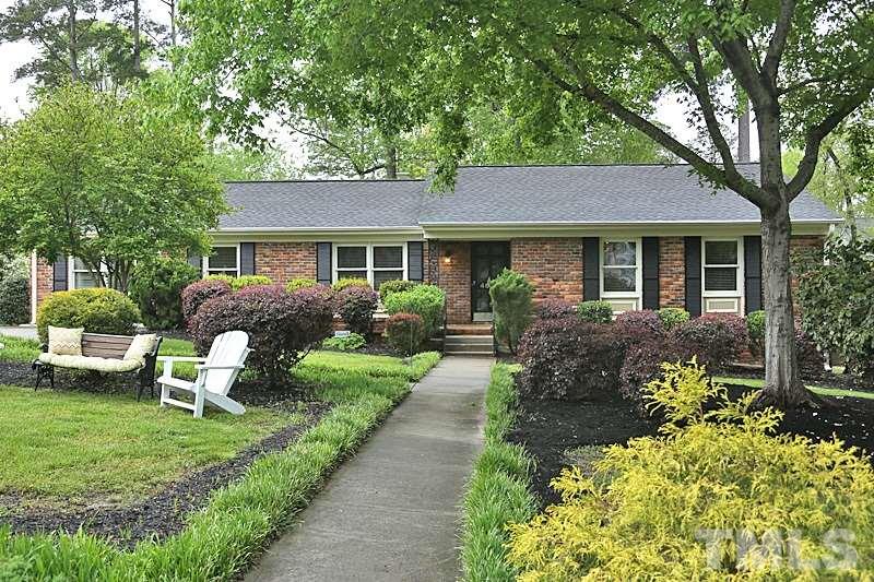 4605 Pitt Street Raleigh, NC 27609 - Photo 1 of 22 a front view of a house with a yard