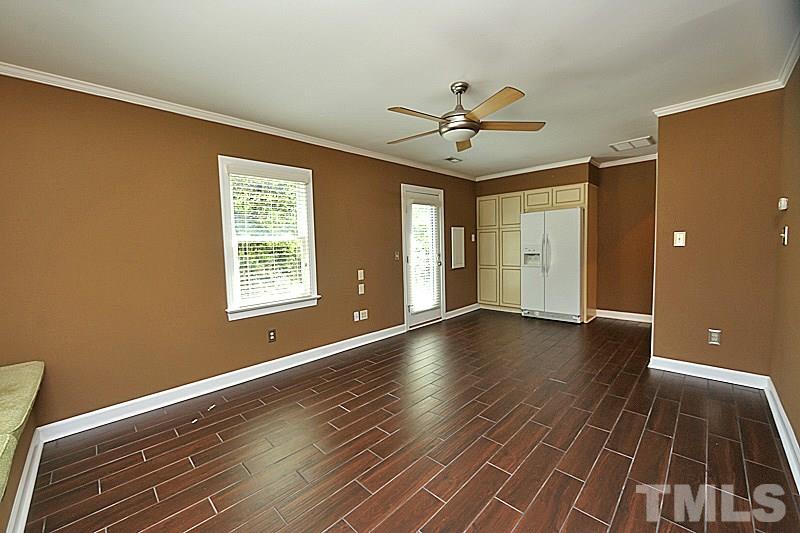 4605 Pitt Street Raleigh, NC 27609 - Photo 14 of 22 a view of an empty room with wooden floor and a window