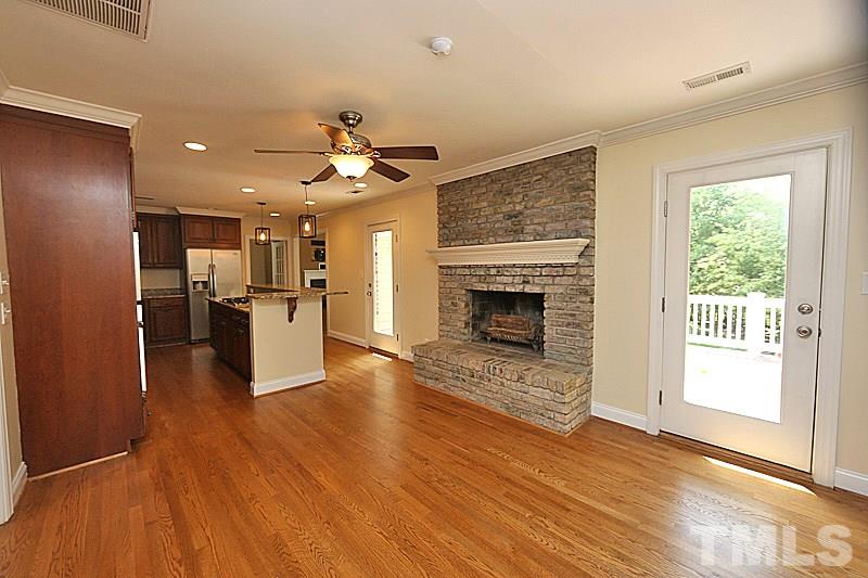 4605 Pitt Street Raleigh, NC 27609 - Photo 7 of 22 a view of a kitchen with a stove cabinets and wooden floor
